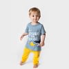 baby boys and toddlers yellow jogging pants and blue t-shirt