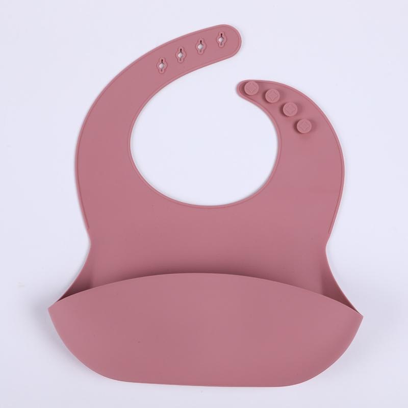 dark pink silicone bib for babies and toddlers